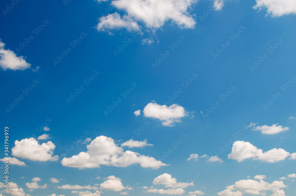 Beautiful fluffy clouds against the blue sky Beautiful fluffy clouds against the blue sky
