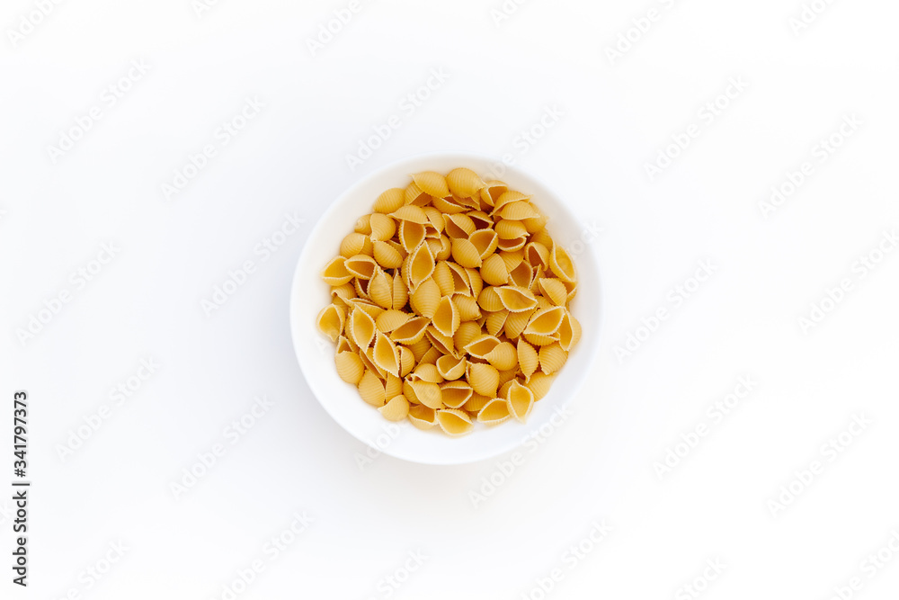 Delicious pasta or penne noodles, isolated on white background. Top view scene, healthy eating or healthy lifestyle. Penne pasta or macaroni in a white bowl, italian cuisine. Delicious pasta or penne noodles, isolated on white background. Top view scene, healthy eating or healthy lifestyle. Penne pasta or macaroni in a white bowl, italian cuisine.