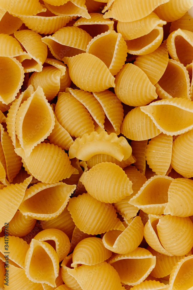 Different uncooked pasta as background, closeup Different uncooked pasta as background, closeup