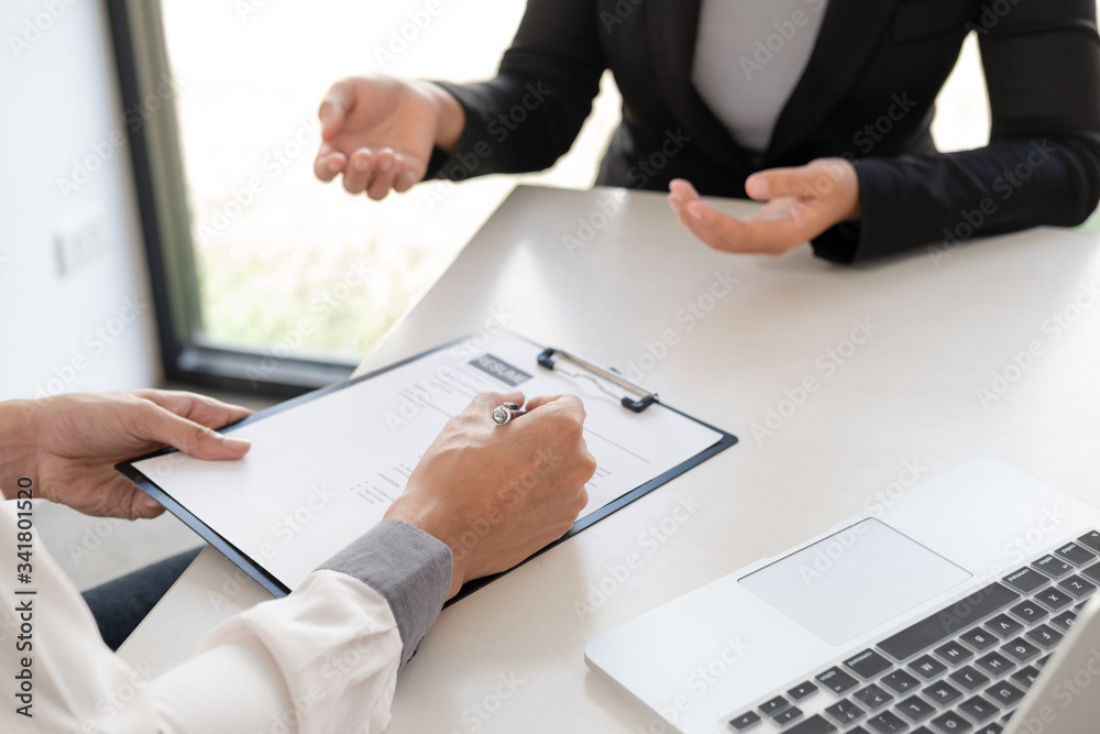 Office executives are interviewing job applicants in the meeting room Office executives are interviewing job applicants in the meeting room