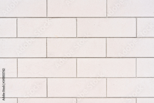 Image of a White Brick Wall Pattern with repeating brick pattern and symmetry