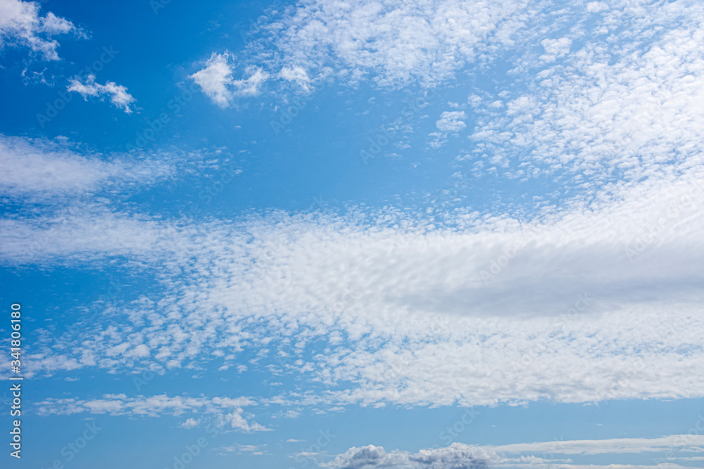 Beautifull blue sky with clouds dispersed all over the sky