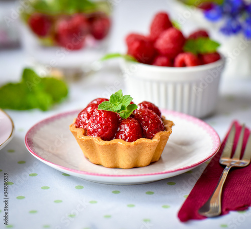 Mini tart with raspberries fruits on the table 