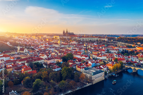 Aerial Prague panoramic drone view of the city of Prague at the Old Town Square  Czechia. Prague Old Town pier architecture and Charles Bridge over Vltava river in Prague at sunset  Czech Republic.