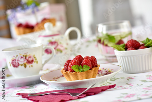 Mini tart with raspberries fruits on the table 