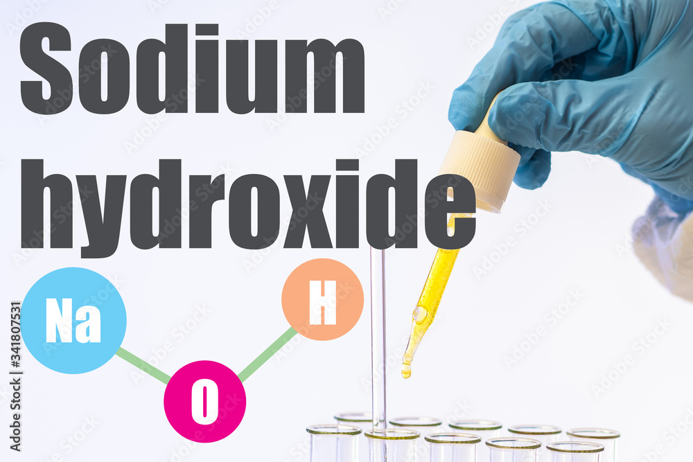 Foto de Inscription Sodium hydroxide next to the hand of a laboratory