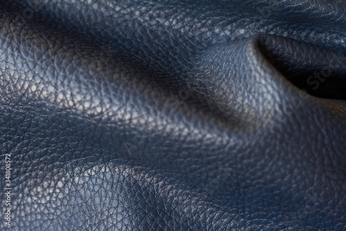 Fotografie Close-up natural qualitative blue leather texture, selective focus