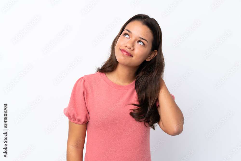 Young Colombian girl over isolated white background thinking an idea Young Colombian girl over isolated white background thinking an idea