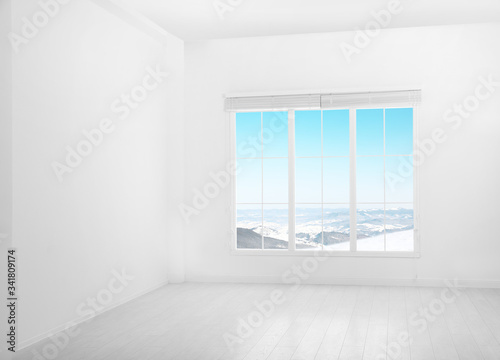 Beautiful view of snowy mountains through big window