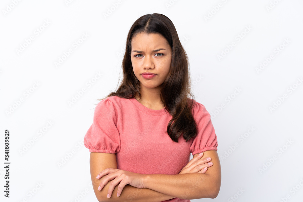 Young Colombian girl over isolated white background feeling upset Young Colombian girl over isolated white background feeling upset