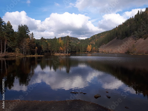 Reflection of trees and sky in blue water - Oslo, lake Sognsvann  photo