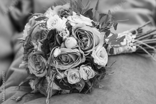 wedding bouquet on an orange pillow, bouquet of bride from rose cream spray, rose bush, rose purple Memory Lane, violet eustoma, eucalyptus