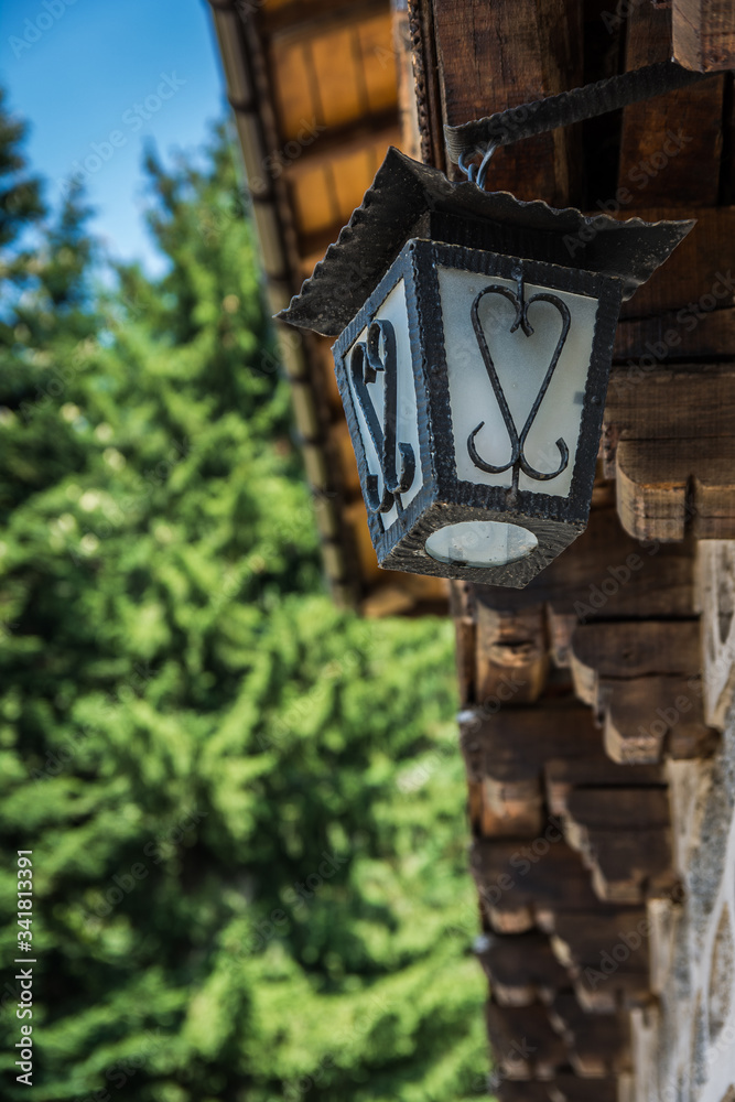 Hand made street lamp of old wooden building in the mountain. Hand made street lamp of old wooden building in the mountain.