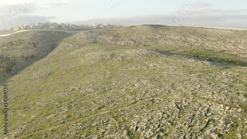 Jerusalem Hills and Palestine town behind concrete walls-Aerial
Drone view over east Jerusalem security wall, 2020
 photo