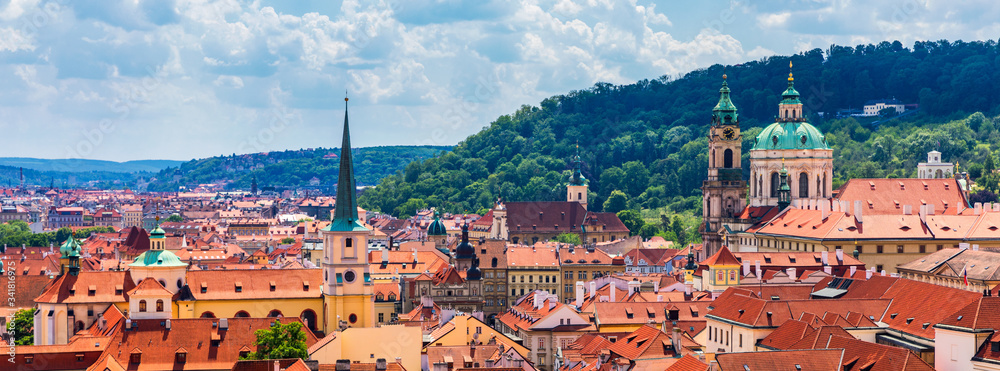 Top view to red roofs skyline of Prague city, Czech Republic. Aerial view of Prague city with terracotta roof tiles, Prague, Czechia. Old Town architecture with terracotta roofs in Prague.