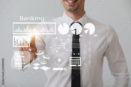 Male bank manager using vir...