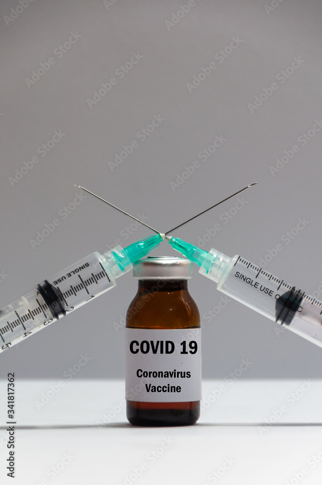 Covid vaccine. Vaccine and syringe injection on white background. Covid vaccine. Vaccine and syringe injection on white background.