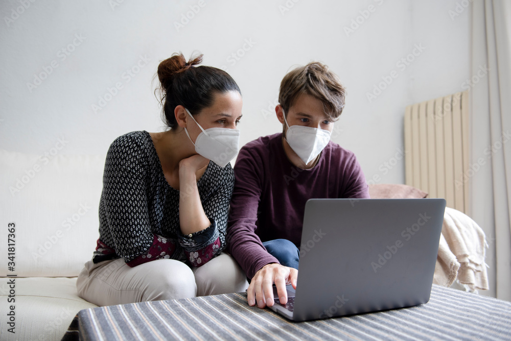 couple watching worried something in the computer couple watching worried something in the computer