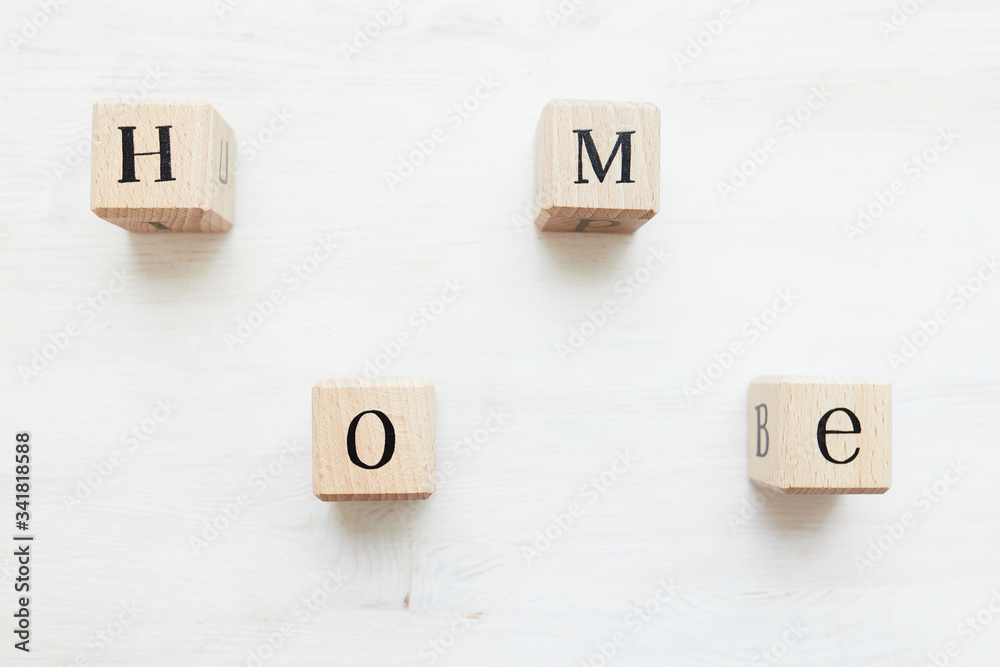 Wooden letter cubes on off-white wooden table. Word Wooden letter cubes on off-white wooden table. Word