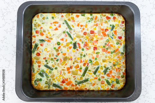 Omelet with vegetables. Baked omelet with vegetables. Omelet close-up. The dawn. Eating Green beans, carrots, peas, peppers, corn. Ready omelet.