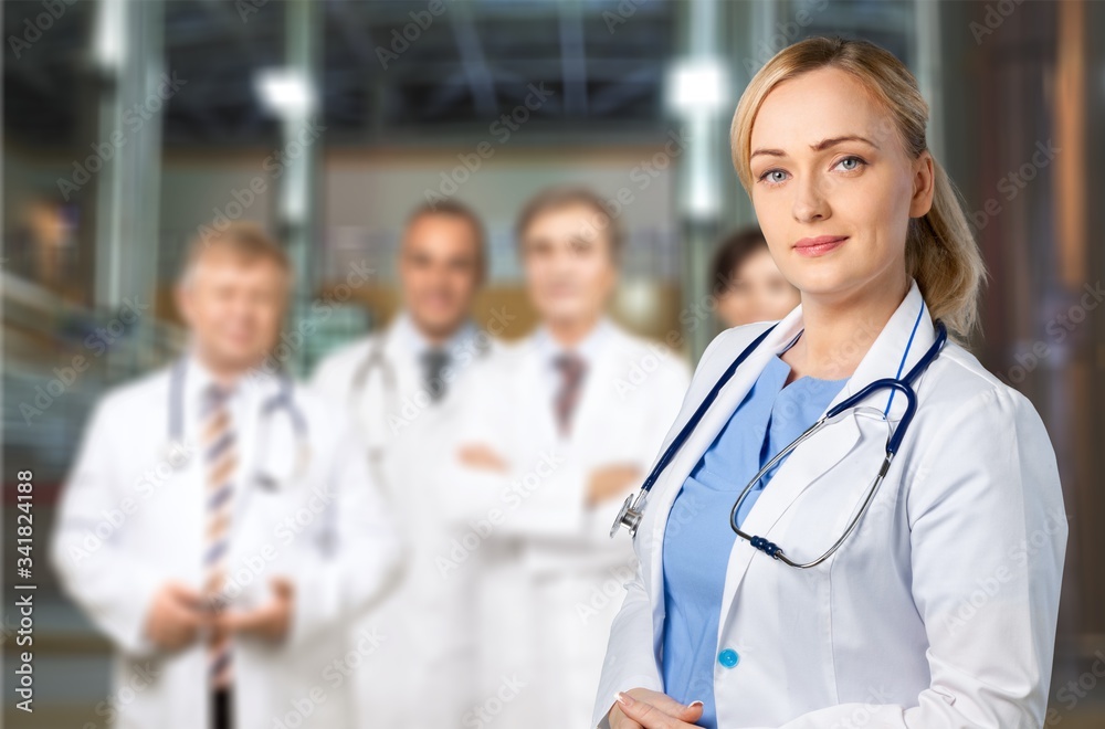 Attractive young female doctor student on background Attractive young female doctor student on background