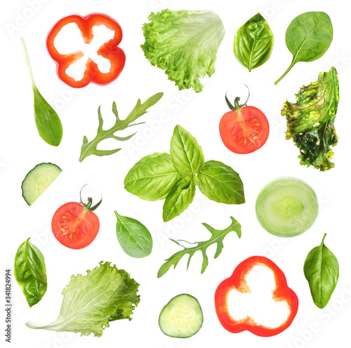 Set of different vegetables and herbs on white background, top view. Fresh ingredients for salad