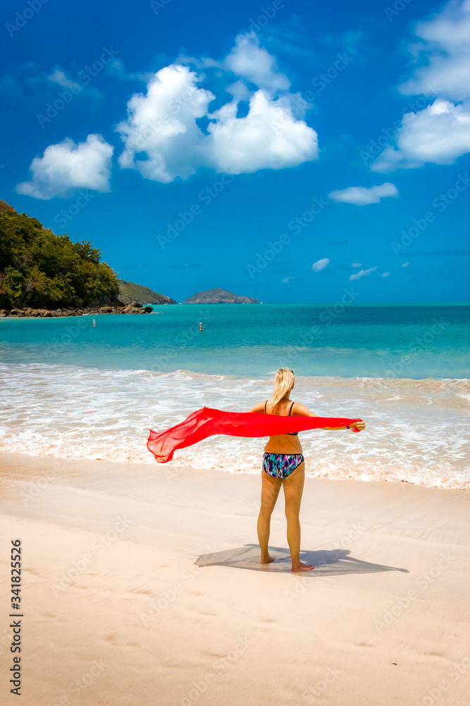 Blonde, caucasian woman enjoying the beach at Magens Bay, US VIrgin Islands