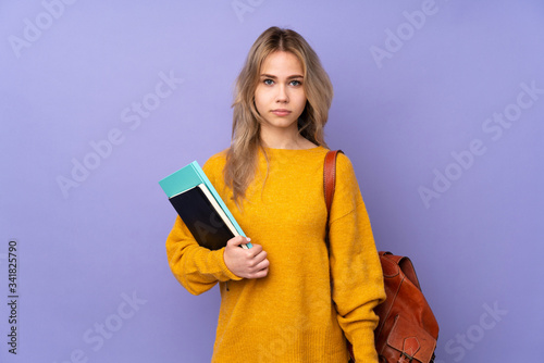 Teenager Russian student girl isolated on purple background making time out gesture