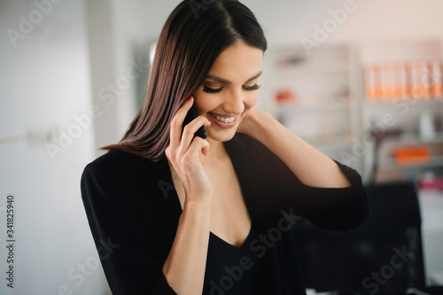 Beautiful businesswoman working in office. Young woman preparing for the meeting.