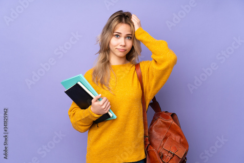 Teenager Russian student girl isolated on purple background with an expression of frustration and not understanding