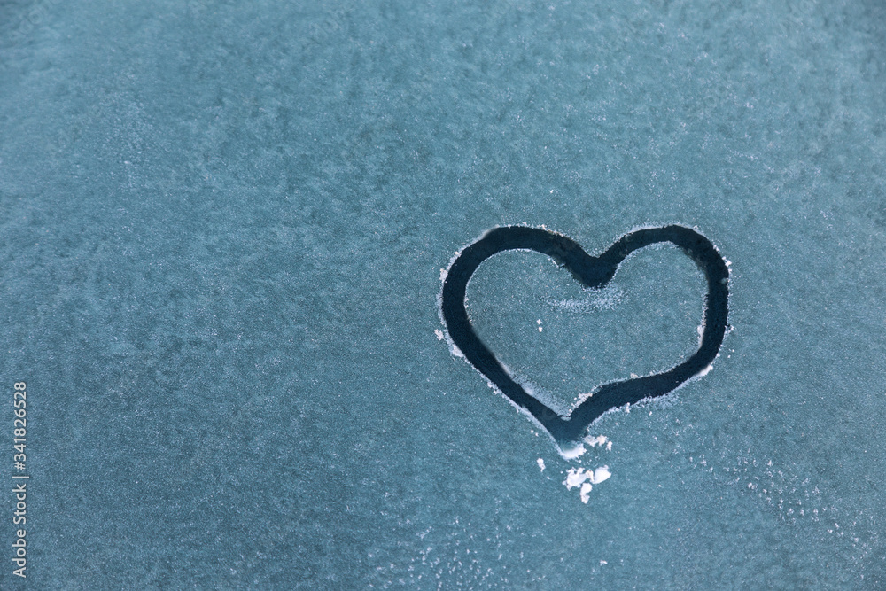 painted heart on frozen glass