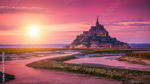 Panoramic view of famous Le Mont Saint-Michel tidal island at sunset, Normandy, northern France photo