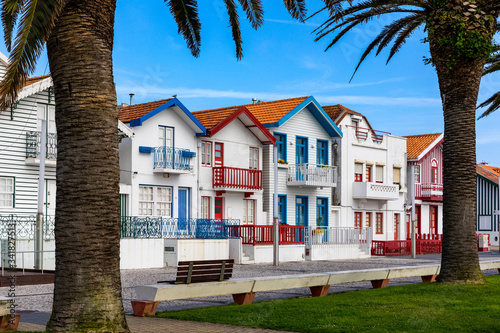 Street with colorful houses in Costa Nova, Aveiro, Portugal. Street with striped houses, Costa Nova, Aveiro, Portugal. Facades of colorful houses in Costa Nova, Aveiro, Portugal.
