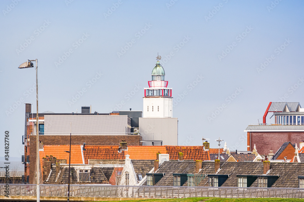 Harlingen, Netherlands - January 10, 2020. Tower of lighthouse with cityscape