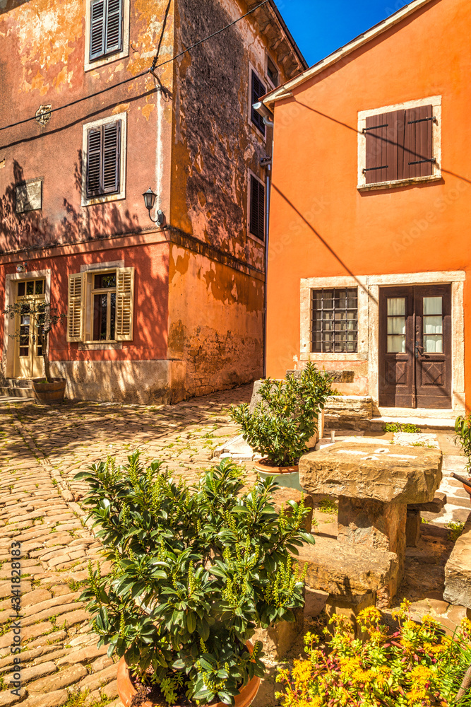 Ancient colorful houses on a stone street in Groznjan village, Istria, Croatia, Europe.