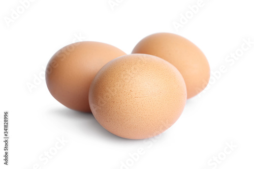 Fresh brown chicken eggs isolated on white