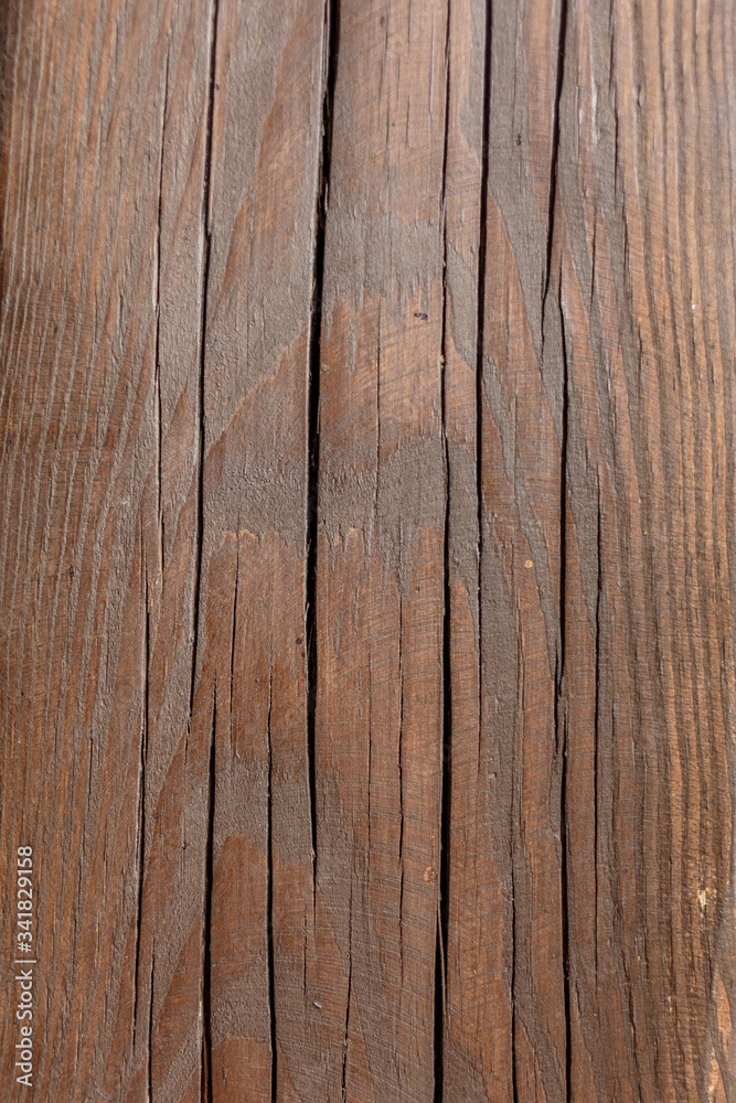 Old wood background in brown colors with deep cracks Old wood background in brown colors with deep cracks