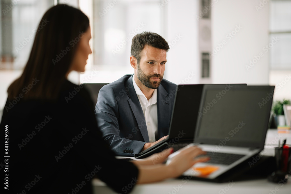 Businessman in office. Handsome man working on project. Businessman in office. Handsome man working on project.