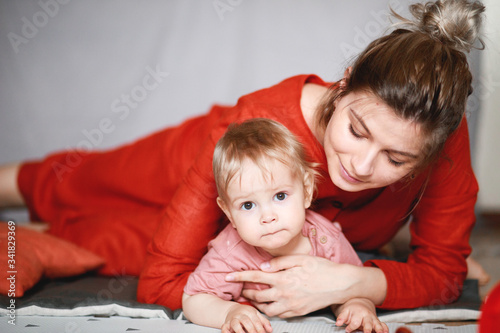 A young mother with her one-year-old little son