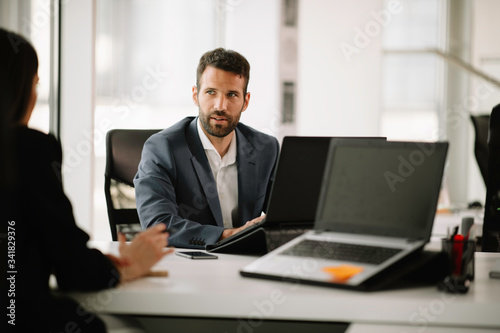 Businessman in office. Handsome man working on project.	