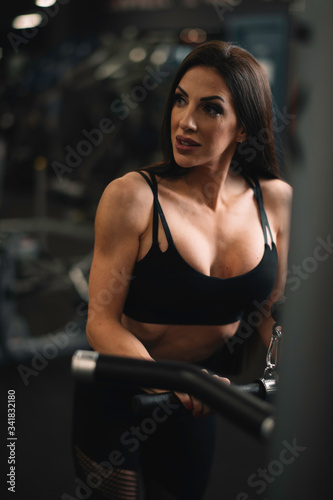 Fitness woman on training. Young woman in the gym. 