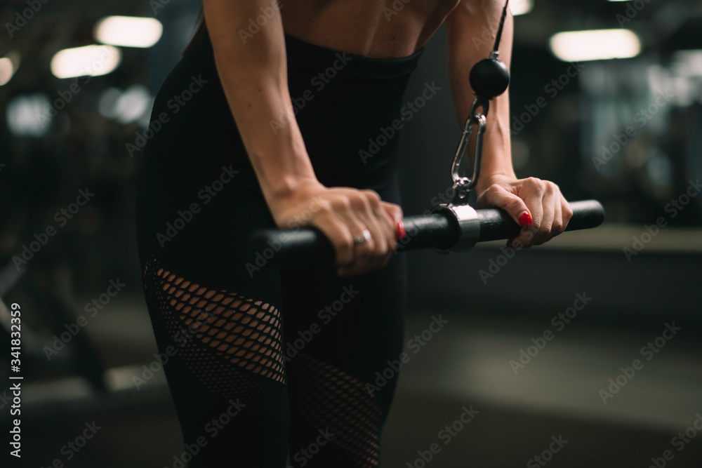 Fitness woman on training. Young woman in the gym. Fitness woman on training. Young woman in the gym.