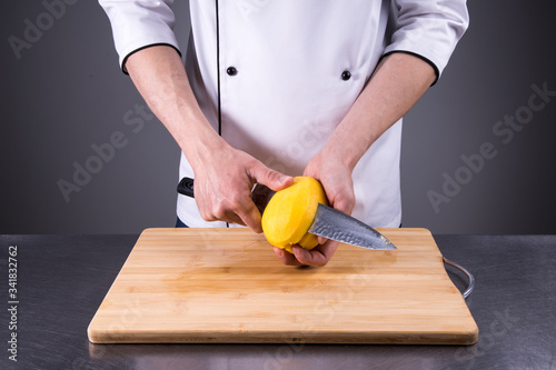chef slices and peels ripe mango in the restaurant kitchen8