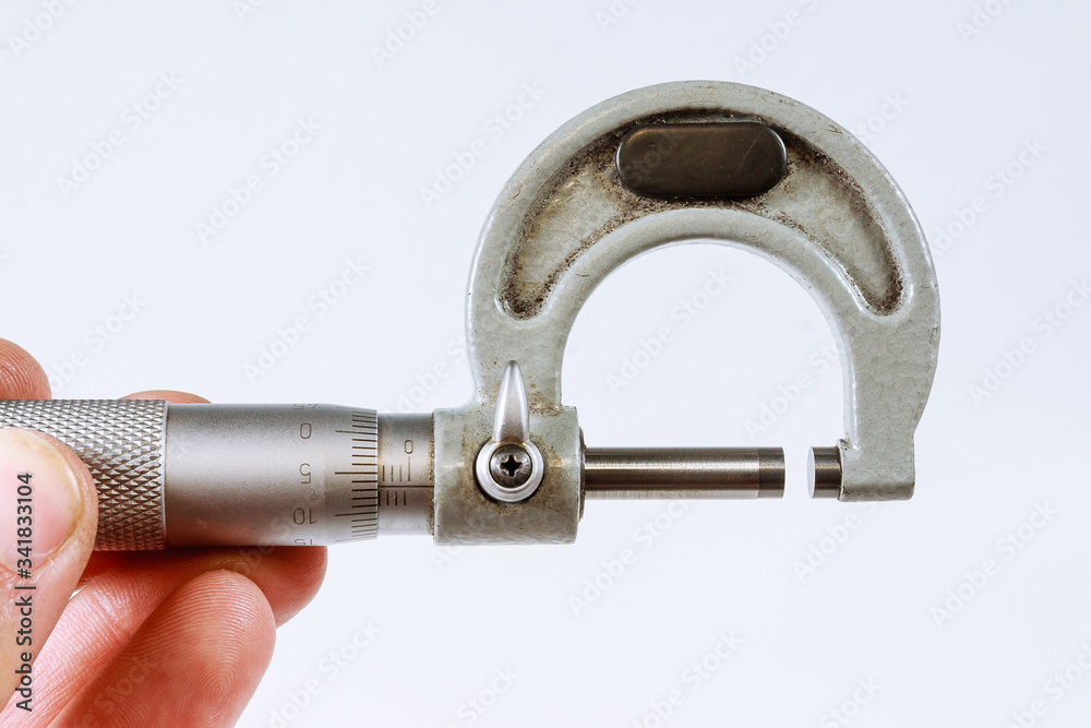 Micrometer on a white background. Modern measuring device. Micrometer on a white background. Modern measuring device.