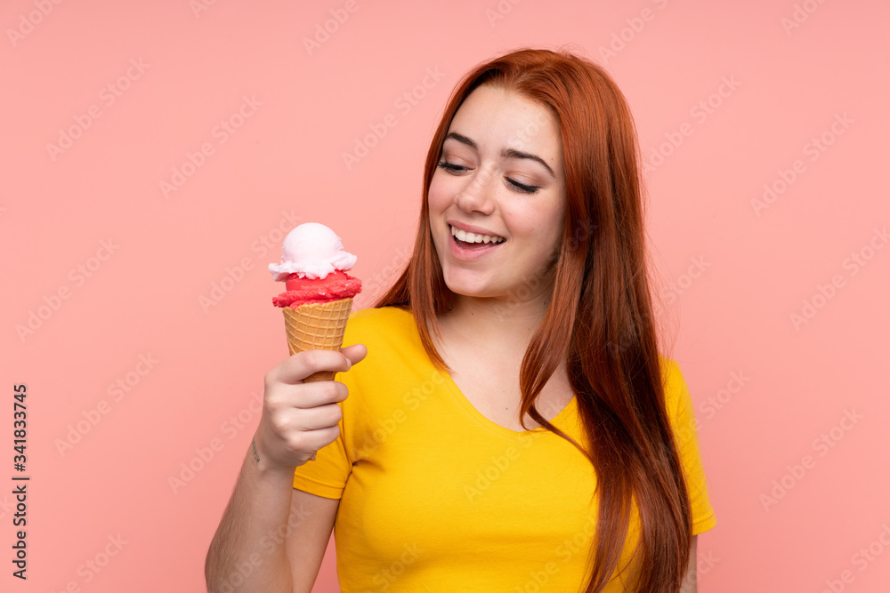 Young girl with a cornet ice cream over isolated background with happy expression Young girl with a cornet ice cream over isolated background with happy expression