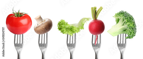 Forks with different vegetables on white background, banner design. Healthy meal