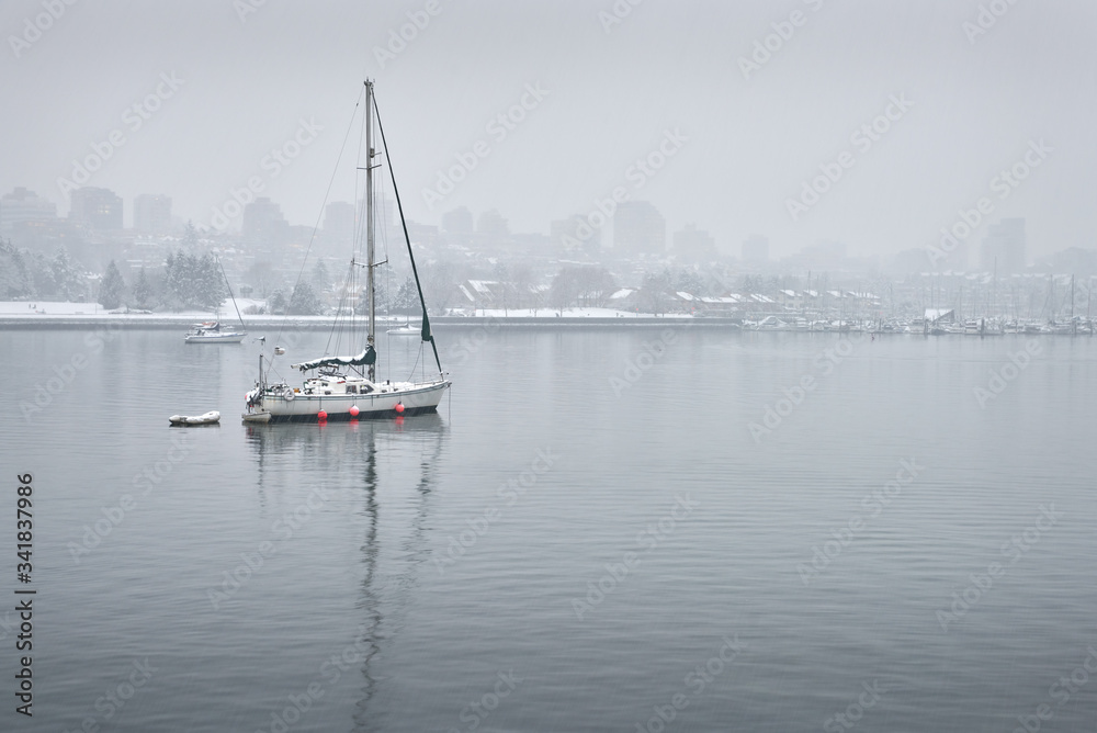 False Creek Sailboat and Snow. Winter snow over False Creek, Vancouver.

