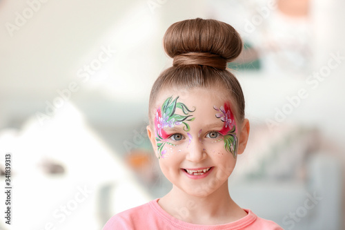 Funny little girl with face...