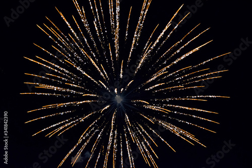 Festive salute in night sky. Explosions of fireworks and pyrotechnics in the sky.