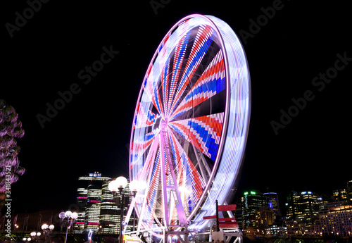 Long exposure photo of a Ferris wheel at night, Darling Harbour, Sydney Australia